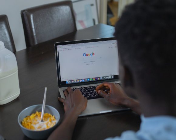 a person using google website on a laptop